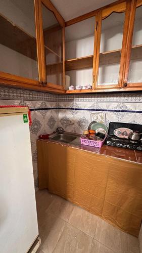 a kitchen with a sink and a counter top at Miramar GuestHouse in Taghazout