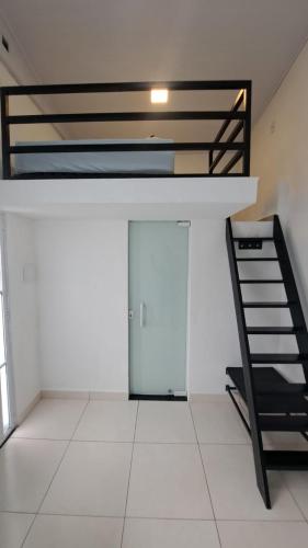 a room with a bunk bed and a door at Pousada do sol in Sorocaba