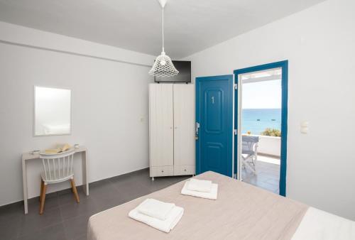 Postel nebo postele na pokoji v ubytování Vista Del Mar Milos