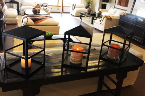 a living room with a table with candles on it at Inca Hoteles in Los Andes