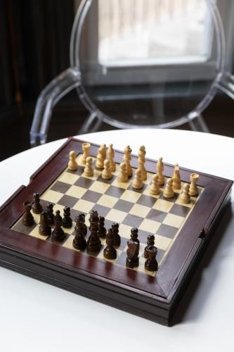 a chess board with chess pieces on a table at The Ipswich Inn in Ipswich