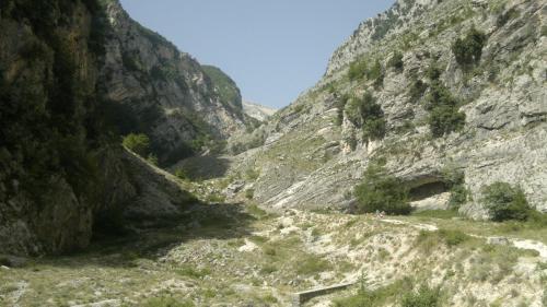 a mountain path through a canyon in the mountains at Le Farfalle at Piano la Fara in Palombaro