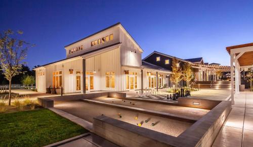a building with a bunch of birds in front of it at New Trendy 1BR Apartment with Heated Pool Gym & Minigolf in Reno