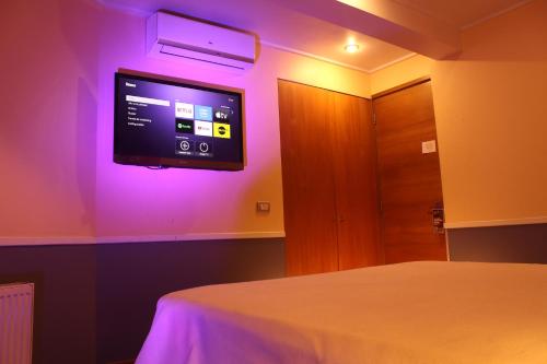Ένα ή περισσότερα κρεβάτια σε δωμάτιο στο GUANAKO Hostel