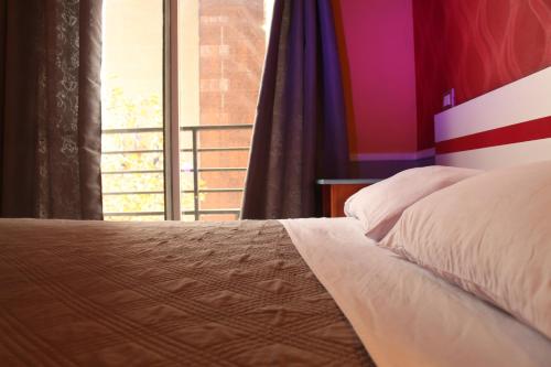 Ένα ή περισσότερα κρεβάτια σε δωμάτιο στο GUANAKO Hostel