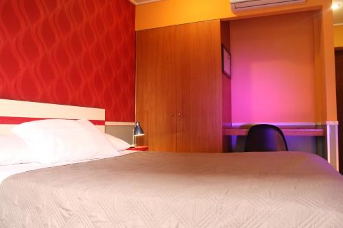 Ένα ή περισσότερα κρεβάτια σε δωμάτιο στο GUANAKO Hostel