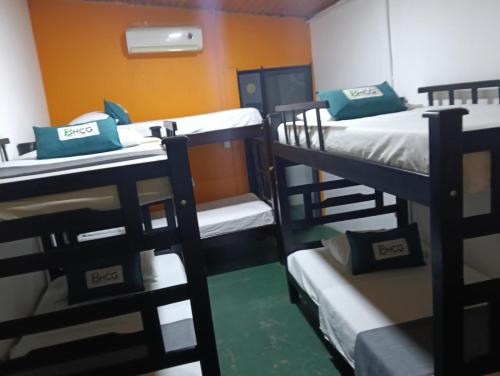 a group of bunk beds in a room at Hostal BioHotel Caribe Green in Santa Marta