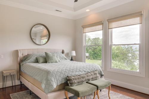 a bedroom with a bed and a mirror and a window at 2-Story Dock and Deck at Huge Family Home in Doyle! in Spencer