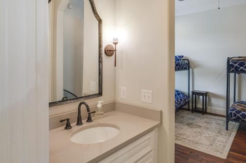 a bathroom with a sink and a mirror at 2-Story Dock and Deck at Huge Family Home in Doyle! in Spencer