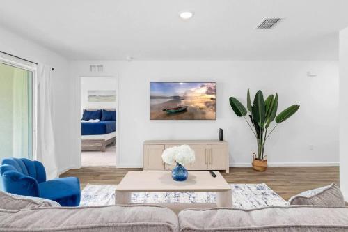 a living room with a couch and a table at Springhill Retreat! 3 bed, 2 Bath! in Spring Hill