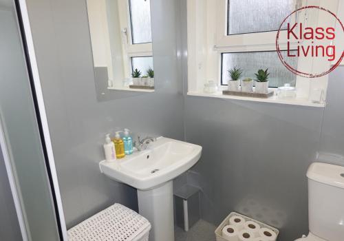 a white bathroom with a sink and a toilet at Welsh Drive Apartment by Klass Living Blantyre in High Blantyre