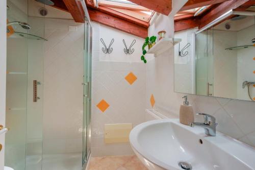 a bathroom with a sink and a shower at Casa Nostra in Pula