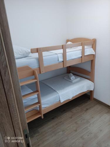 a bunk room with two bunk beds in it at Apartmani Gaga in Tivat