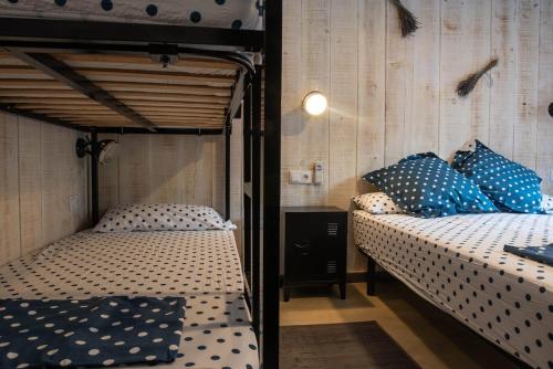 Postel nebo postele na pokoji v ubytování casa nueva de pueblo con piscina y barbacoa