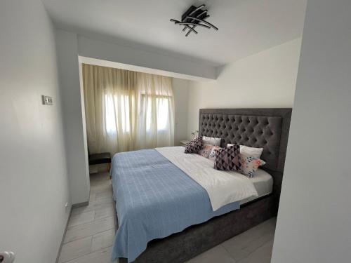 a bedroom with a large bed and a window at IGiDELUX in Era de Soler