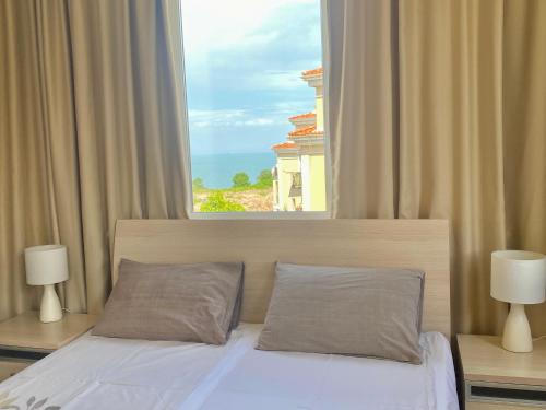 A bed or beds in a room at Apartments in complex ATIA RESORT