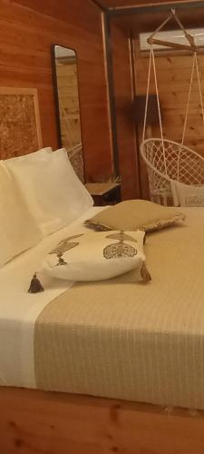 two beds sitting next to each other in a room at Wooden Summer House in Mantoúkion