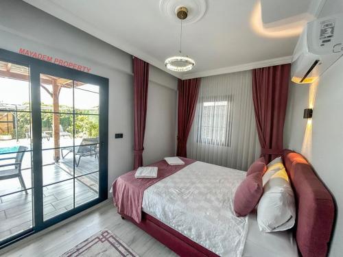 Ένα ή περισσότερα κρεβάτια σε δωμάτιο στο Villa LUX