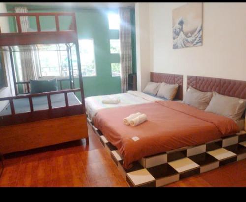 Katil atau katil-katil dalam bilik di Da Lat Inn Retreat
