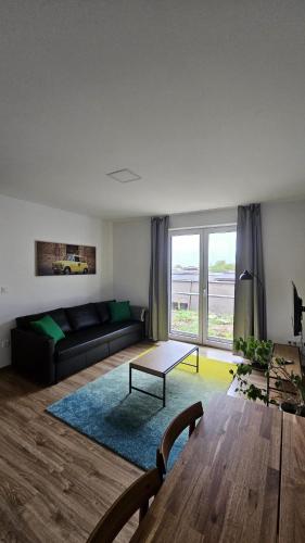 a living room with a couch and a table at Apartmán Kateřina in Nové Město nad Metují