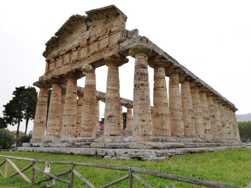 an ancient building with columns in a field at B&BMarì in Pontecagnano