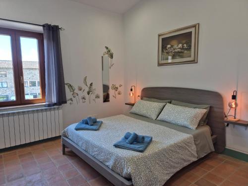 Postel nebo postele na pokoji v ubytování Casa Gavì