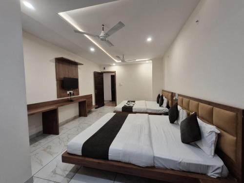 Cama o camas de una habitación en Hotel PRAKASHAM