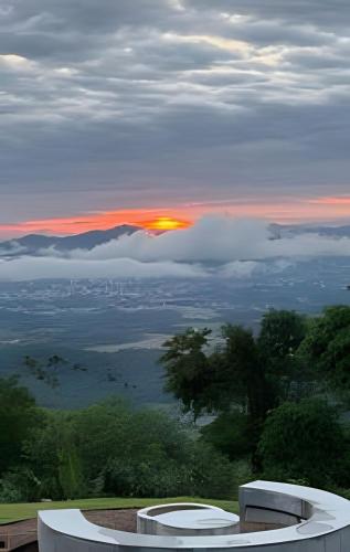 a view of the sunset from the top of a building at Acampamento do Bosque in Rodeio