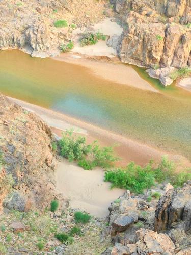 an aerial view of a river with rocks at Guest House Abde Rrahim Baallal in Skoura