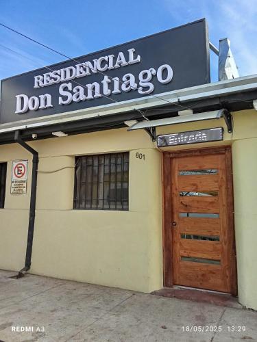 a building with a sign that reads residential don santario at Residencial Don Santiago in Talca