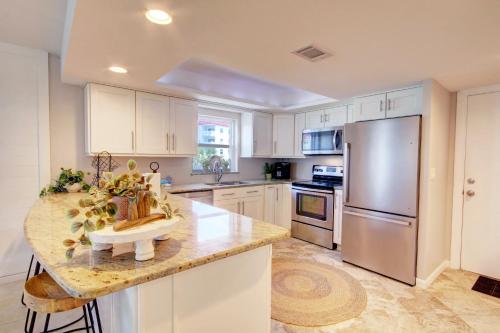 a kitchen with white cabinets and a granite counter top at El Matador 339 - FREE ACTIVITIES!! Your stay includes $761.00 in complimentary activities. in Elberta