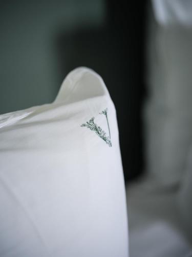 a close up of a napkin with a flower on it at Domaine Le Verbois in Chantilly