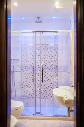 a bathroom with a shower and a toilet and a sink at Ca' Amadi in Venice