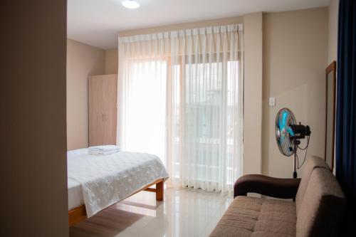 Ένα ή περισσότερα κρεβάτια σε δωμάτιο στο El Hogar de Olguita - Departamento Balcón