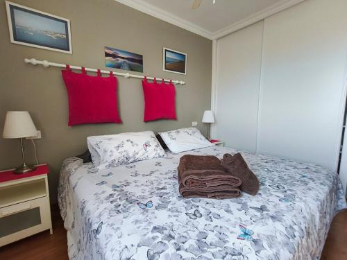 a bedroom with a bed with a blanket on it at Los Cristianos Ocean View Suite 2 bedrooms in Los Cristianos