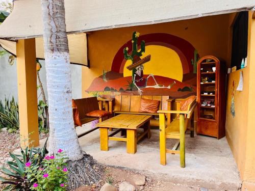 a table and bench outside of a house at Wasi la Punta 4 Starlink 2min walk to the beach in Brisas de Zicatela