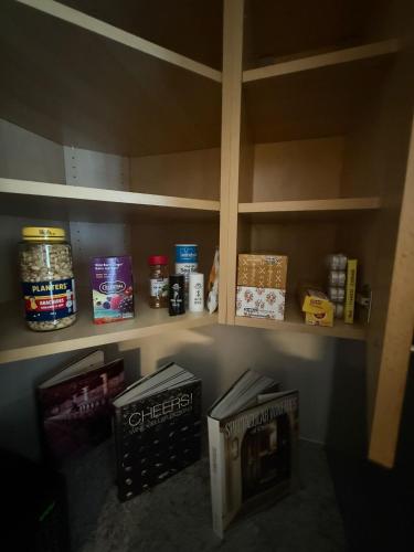 a pantry with shelves with food on it at Budget Stay For Travellers to Canada Wonderland,Toronto in Vaughan