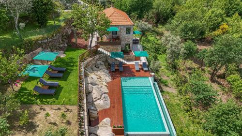 an aerial view of a resort with a swimming pool at ALDEIA DA MARGARIDA in Tarouquela