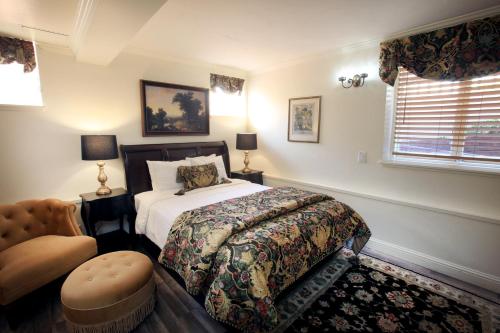 a bedroom with a bed and a window at The Charles Pacific Grove in Pacific Grove