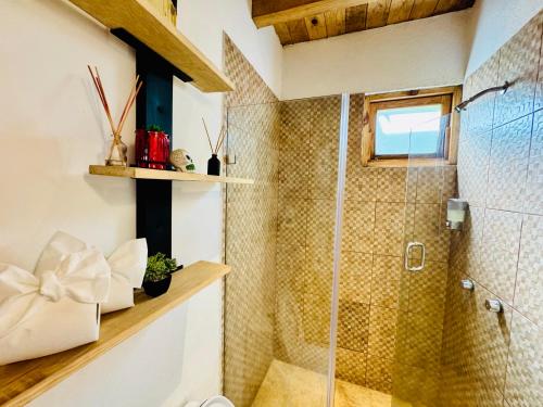 a bathroom with a shower with a glass door at Encino House Hotel Boutique in Valle de Bravo