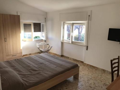 Ένα ή περισσότερα κρεβάτια σε δωμάτιο στο Villa Marcella