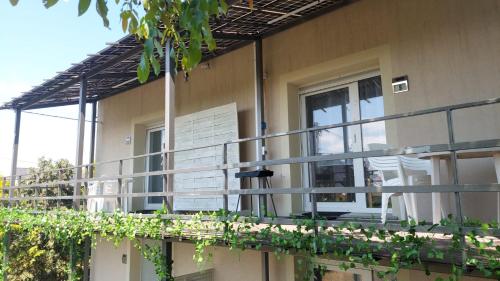 a balcony of a house with plants on it at Hotel Konty in Kąty Opolskie