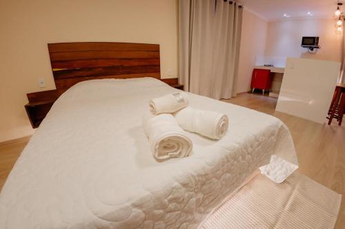 Ένα ή περισσότερα κρεβάτια σε δωμάτιο στο Chalé Montana Pedra Azul