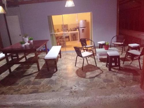 a living room with a table and chairs and a table and chairsktop at HospedajesPerú in Zorritos