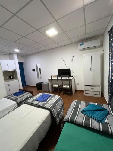 Ένα ή περισσότερα κρεβάτια σε δωμάτιο στο RESIDENCIAL SIC