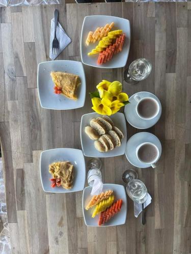 a group of plates of food on a table at cabañas campestres buena vista in Paicol