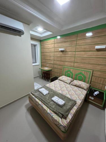 a bedroom with a bed in a room at Cruz De MaIta Hotel in Sao Paulo