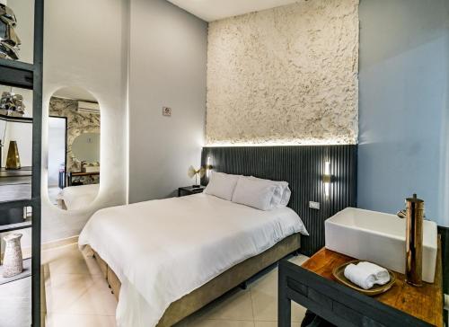 Ένα ή περισσότερα κρεβάτια σε δωμάτιο στο One Apartments Lleras