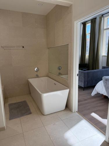 a bathroom with a white tub in a room at Unicorn Zebra in Tucson
