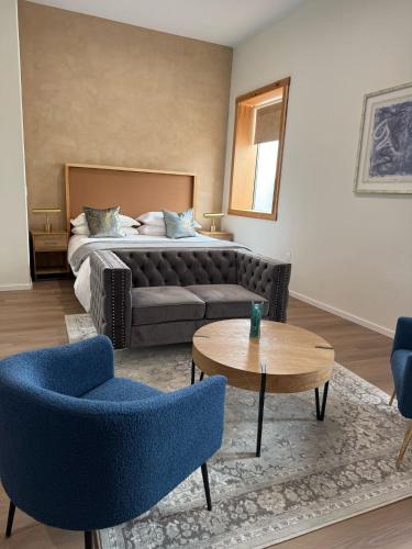 a living room with a couch and a bed at Unicorn Zebra in Tucson